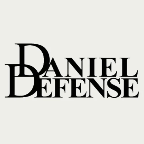 Black text logo with the words "Daniel Defense" in uppercase, overlapping serif font, on a light gray background. The large "D" in "Daniel" and "Defense" are stacked and share the same letter.